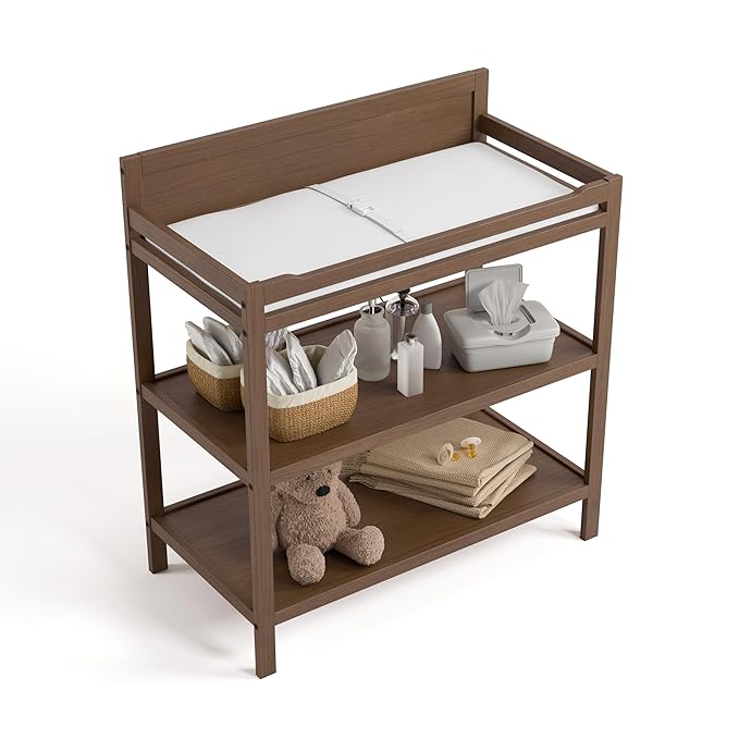 Storkcraft Alpine Changing Table (Hazelnut) - Includes Water Resistant Changing Pad with Safety Strap, 2 Open Shelves for Storage
