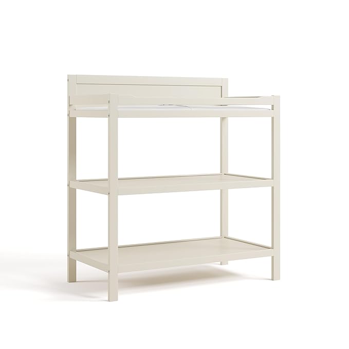 Storkcraft Alpine Changing Table (Frosted Oat) - Includes Water Resistant Changing Pad with Safety Strap, 2 Open Shelves for Storage