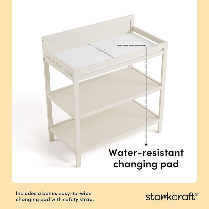 Storkcraft Alpine Changing Table (Frosted Oat) - Includes Water Resistant Changing Pad with Safety Strap, 2 Open Shelves for Storage
