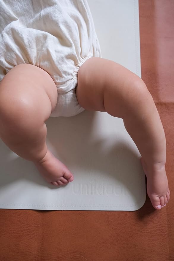Vegan Leather Changing Mat by UNIKLOOK | Baby Infant Toddler Multipurpose | Waterproof Diaper Pad Placement Pet or Desk Mat Portable Foldable for Travel Wipeable Double Sided (14x22 in) Blanc + Rose