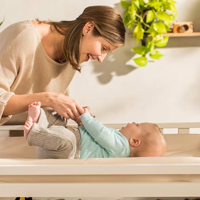 Naturepedic Organic Contoured Changing Pad - Easy to Clean, Lightweight & Portable - Comfort 4-Sided Waterproof Baby Diaper Changing Pad for Dresser or Changing Table - 16" x 31"