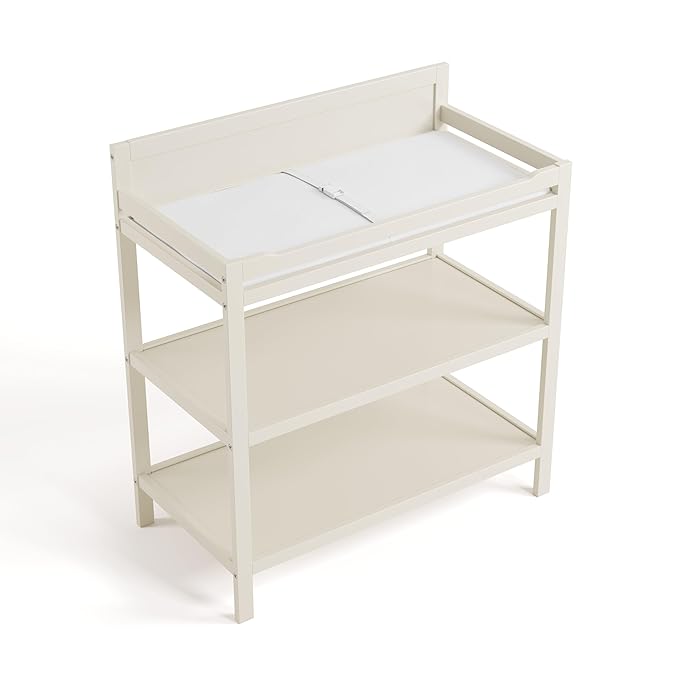 Storkcraft Alpine Changing Table (Frosted Oat) - Includes Water Resistant Changing Pad with Safety Strap, 2 Open Shelves for Storage