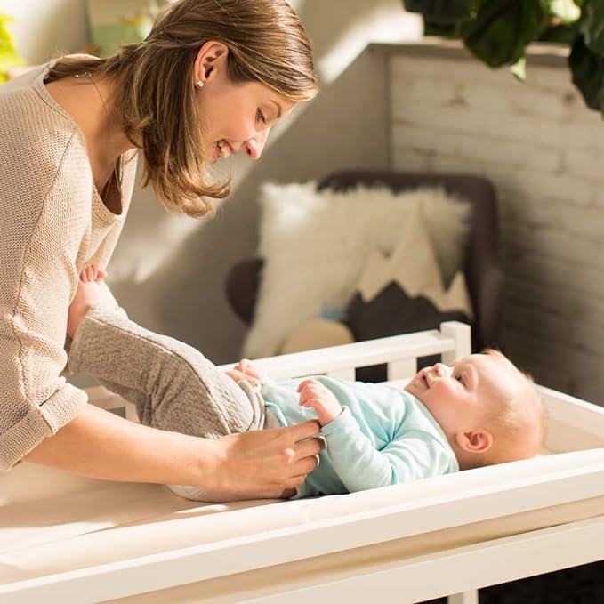 Naturepedic Organic Contoured Changing Pad - Easy to Clean, Lightweight & Portable - Comfort 4-Sided Waterproof Baby Diaper Changing Pad for Dresser or Changing Table - 16" x 31"