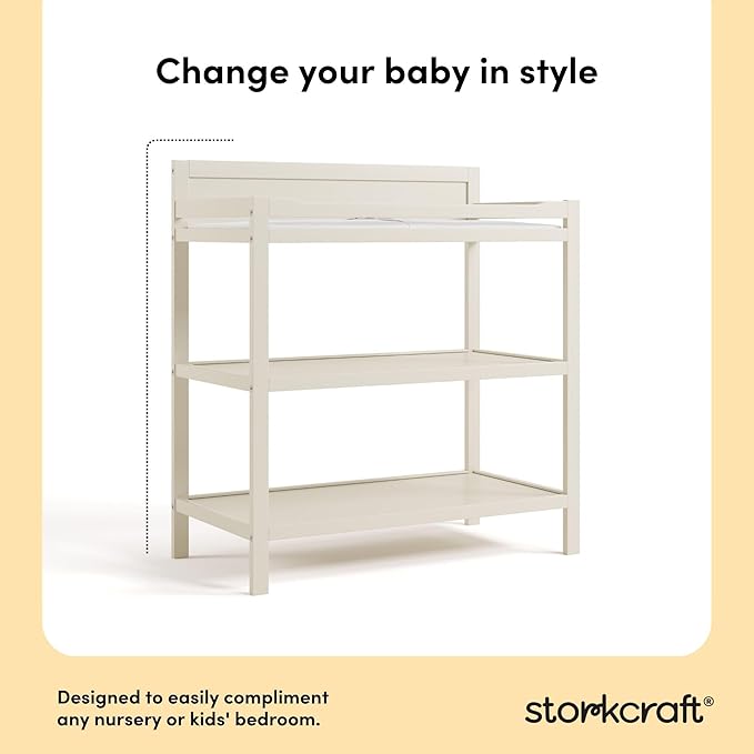 Storkcraft Alpine Changing Table (Frosted Oat) - Includes Water Resistant Changing Pad with Safety Strap, 2 Open Shelves for Storage