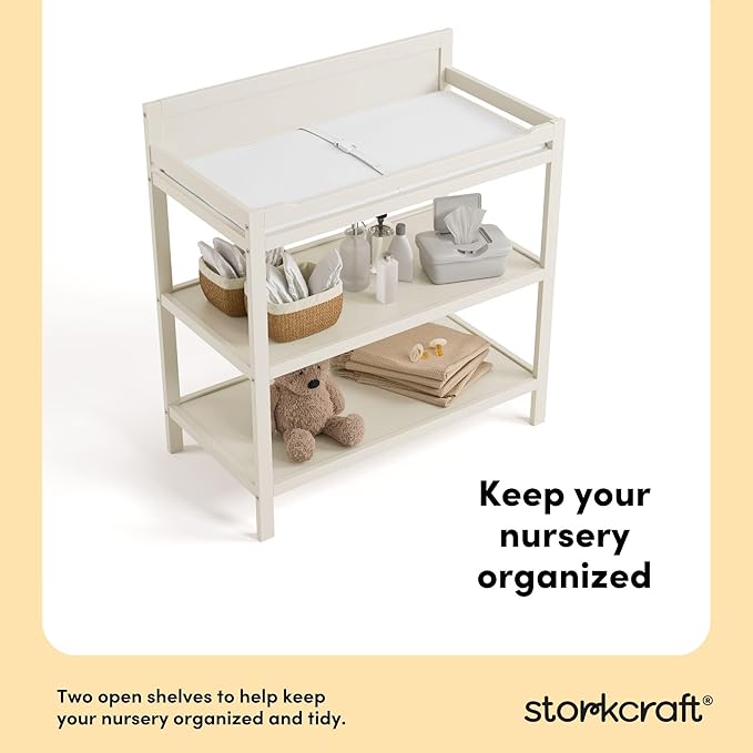 Storkcraft Alpine Changing Table (Frosted Oat) - Includes Water Resistant Changing Pad with Safety Strap, 2 Open Shelves for Storage