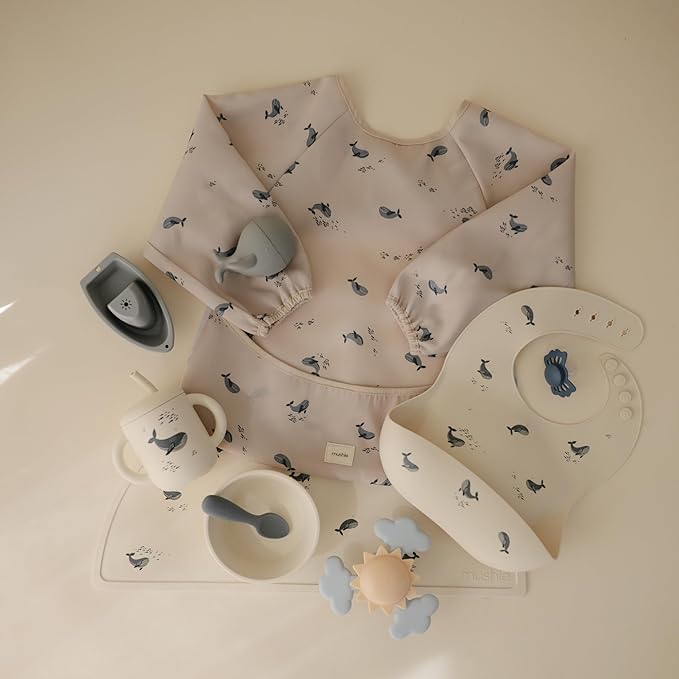 mushie Long Sleeve Baby Bib | Water Resistant Adjustable Fit for Ages 6-24 Months