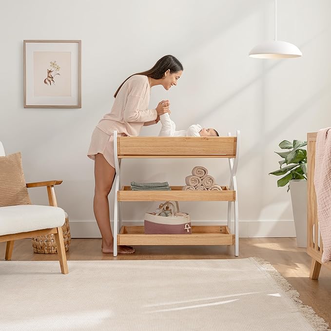 Comfy Cubs Baby Changing Table - Sturdy Wood Construction, Timeless Look Baby Change Table with Two Open Shelves for Infant Daycare Essentials Storage - Natural Wood with White Legs