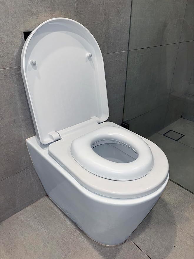 Dreambaby Soft Touch Potty Seat - Comfortable Padded Seat - With High Base Underneath for Secure Positioning - Fit Most Standard Toilets - White - Model L604