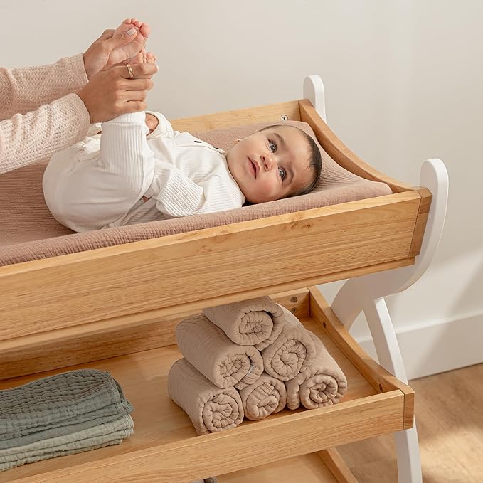 Comfy Cubs Baby Changing Table - Sturdy Wood Construction, Timeless Look Baby Change Table with Two Open Shelves for Infant Daycare Essentials Storage - Natural Wood with White Legs