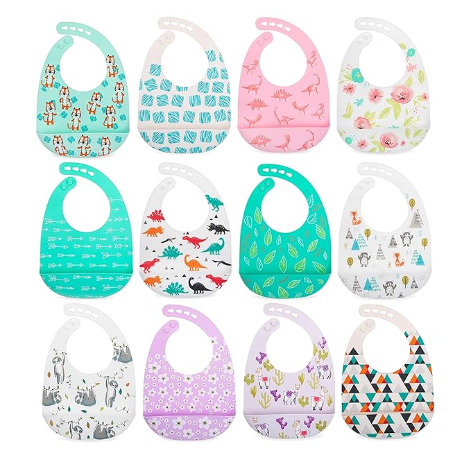 Nuby 2 Pack Adjustable Easy Clean Soft Silicone Bibs with Scoop, Pink Dinosaurs & Flowers